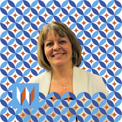 Debi, Our Processing And Mending Specialist, Poses In Front Of A Blue And Orange Circular Pattern.