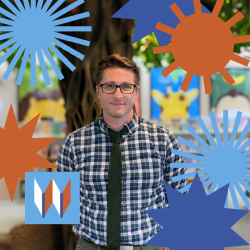 Cody, The Director Of Whitman County Rural Libraries, Poses Among Blue And Orange Stars At The Colfax Library.